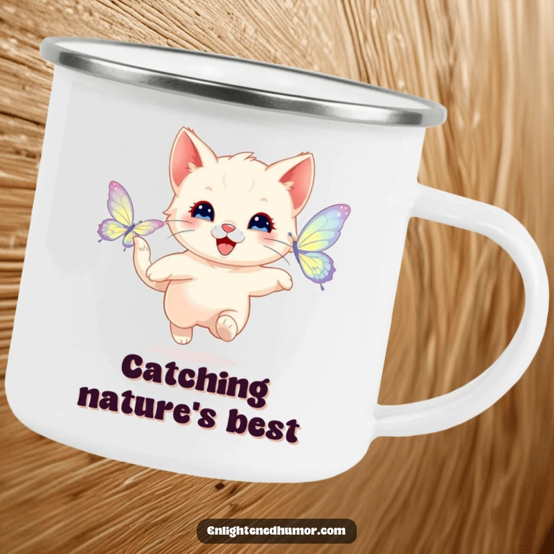 Funny enamel camping mug featuring a happy kitten playfully chasing a shimmering butterfly with radiant wings, perfect for fun outdoor beverages.