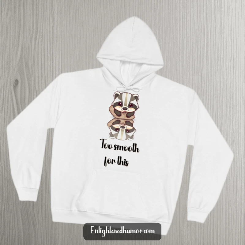 Funny hoodie featuring a beaming badger discovering its reflection in a perfectly smooth, polished stone, radiating warmth and humor.