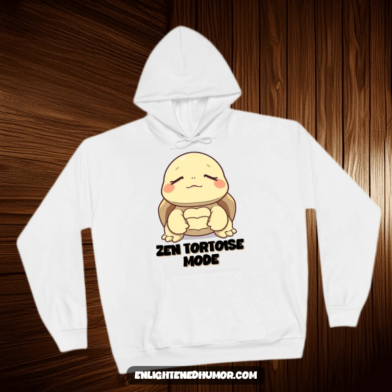 Funny hoodie featuring a tortoise in a meditative state, eyes closed, symbolizing tranquility and relaxed humor.