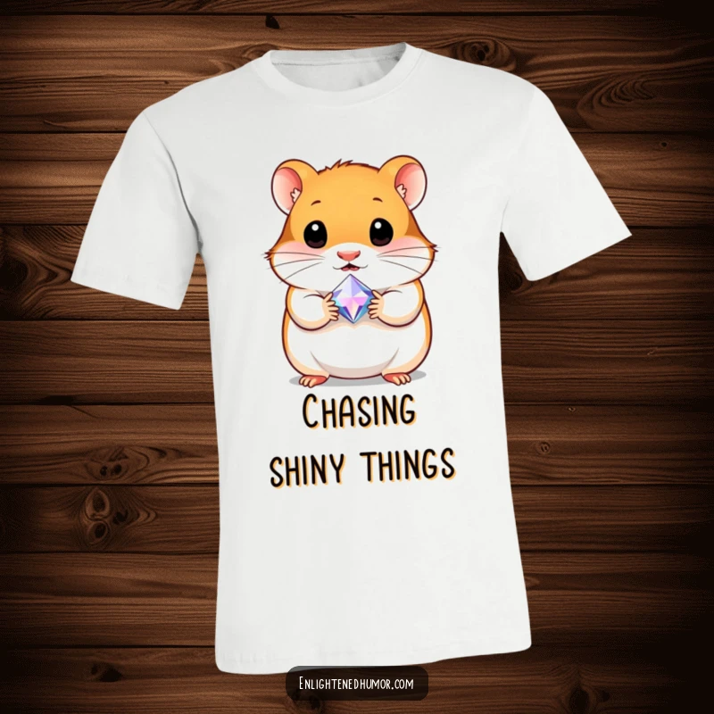 Funny t-shirt showcasing a curious hamster clutching a tiny, radiant gem, celebrating discovery and precious moments with a smile.