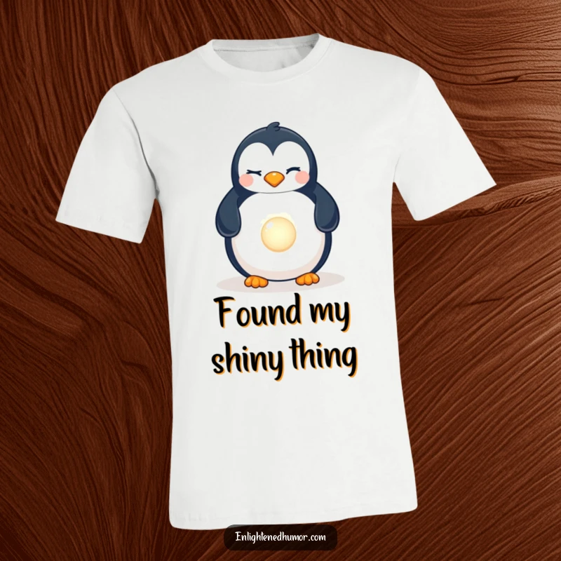 Funny Penguin Pearl T-Shirt: A playful penguin winking, excitedly finding a hidden, brilliant, luminescent pearl.