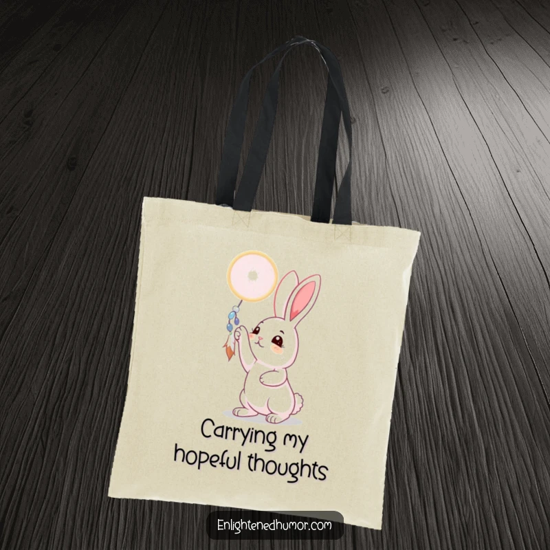 Funny rabbit tote bag with a curious bunny reaching for a shimmering dreamcatcher, perfect for carrying dreams and essentials, a whimsical practical gift.